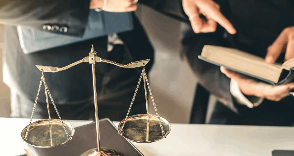 Untitled design – 2024-03-12T155908.796 Attorney looking in a book