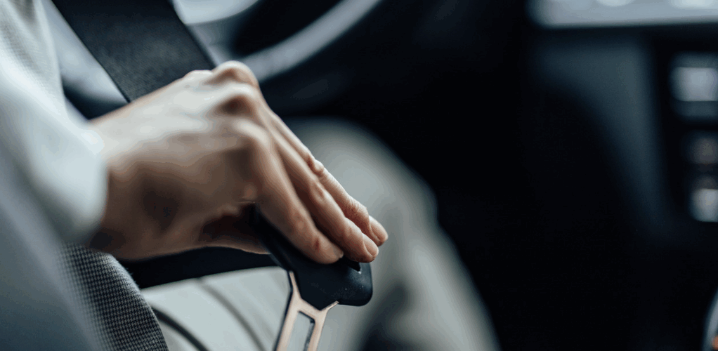 Screenshot 2024-09-23 at 1.19.32 PM seatbelt being buckled in for safe driving