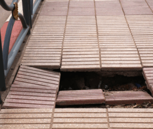hole in the sidewalk causing a liability