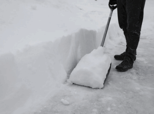 Shoveling snow on sidewalk